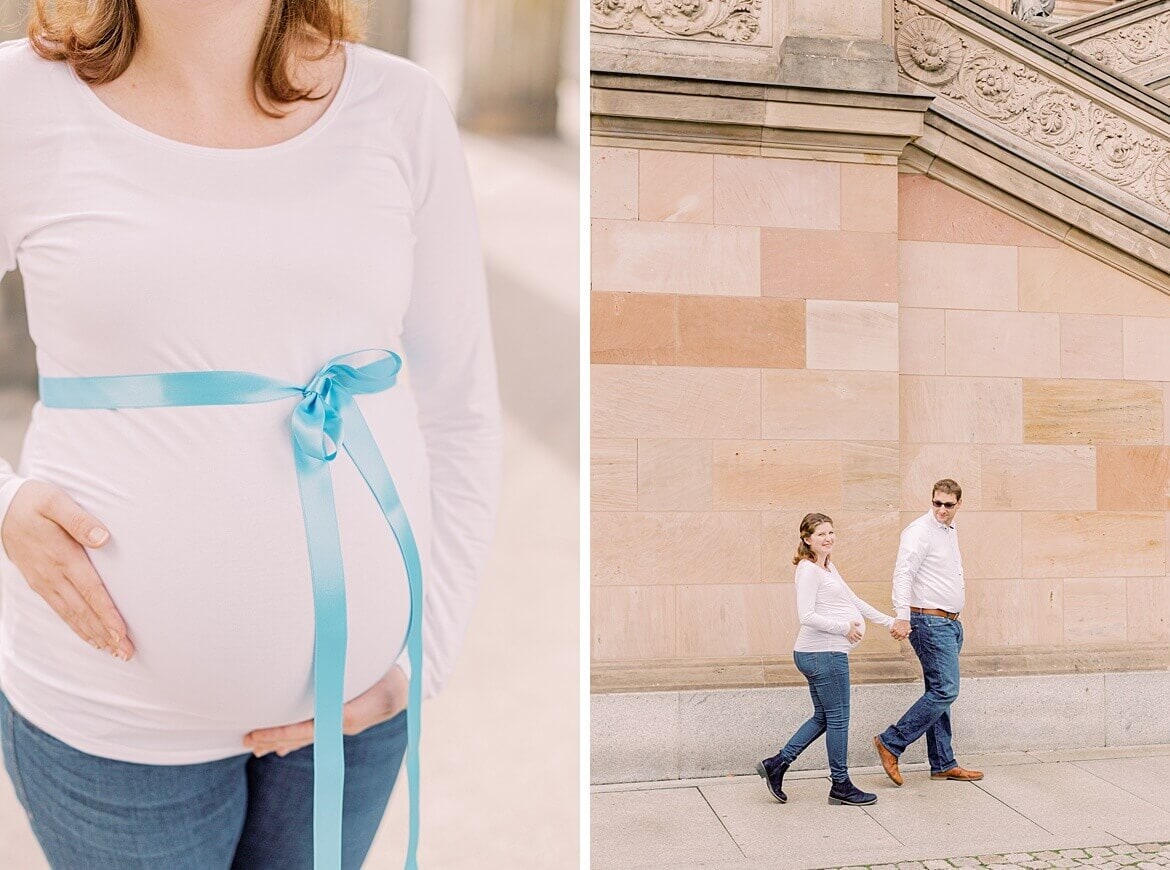 Babybauch mit blauer Schleife